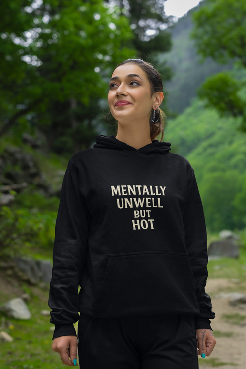Woman wearing black "Mentally Unwell but Hot" hoodie outdoors